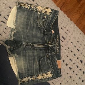 American Eagle distressed shorts with side detailing. NWT